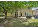 Spacious backyard featuring a patio, tree, and basketball hoop at 826 Richmond Cir, Peachtree City, GA 30269