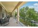 Relaxing balcony with black metal railings and comfortable seating overlooking the manicured lawn at 826 Richmond Cir, Peachtree City, GA 30269
