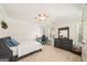 Fun bedroom with a bed, desk and dresser. The ceiling fixture is decorated with planets at 826 Richmond Cir, Peachtree City, GA 30269