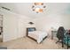 Fun bedroom featuring a cozy bed, a modern desk setup, and unique decorative elements, creating an inviting space at 826 Richmond Cir, Peachtree City, GA 30269
