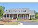 Community clubhouse featuring a covered front porch and landscaped front yard at 826 Richmond Cir, Peachtree City, GA 30269
