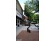 Community walkway with benches and a statue near shopping at 826 Richmond Cir, Peachtree City, GA 30269