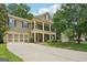 Charming two-story home features a welcoming front porch and attached two-car garage at 826 Richmond Cir, Peachtree City, GA 30269