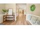 Inviting foyer featuring hardwood floors, a bench, and a clear view into the living space enhancing the home's appeal at 826 Richmond Cir, Peachtree City, GA 30269