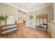 Inviting foyer with hardwood floors, decorative molding, and a charming bench and coat rack, creating a warm welcome at 826 Richmond Cir, Peachtree City, GA 30269