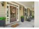 Charming front porch featuring rocking chairs, a welcome mat, and decorative accents adding to the home's curb appeal at 826 Richmond Cir, Peachtree City, GA 30269