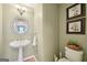 Charming half bathroom with stylish fixtures, decorative accents, and a clean, inviting feel at 826 Richmond Cir, Peachtree City, GA 30269