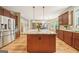Spacious kitchen with a large central island, granite counters and open concept design for easy entertaining at 826 Richmond Cir, Peachtree City, GA 30269