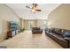 Comfortable living room with high ceilings, TV, and plush leather seating at 826 Richmond Cir, Peachtree City, GA 30269