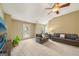 Spacious living room with two couches and a TV, featuring natural light and modern design at 826 Richmond Cir, Peachtree City, GA 30269