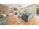 Inviting living room featuring a fireplace, built-in shelves, and backyard access at 826 Richmond Cir, Peachtree City, GA 30269