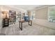 Well-lit home office with custom shelving and a comfortable workspace with great natural light at 826 Richmond Cir, Peachtree City, GA 30269