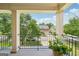 Open porch view with black metal railing overlooking green lawns and other homes at 826 Richmond Cir, Peachtree City, GA 30269