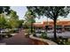 Shopping center with storefronts, landscaping, and parking at 826 Richmond Cir, Peachtree City, GA 30269