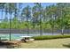 Active community tennis court featuring a picnic table and lights at 826 Richmond Cir, Peachtree City, GA 30269