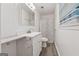Bathroom with a modern vanity, a decorative mirror, and lots of natural light at 3123 Deshong Dr, Stone Mountain, GA 30087