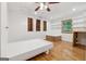 Bright bedroom features modern finishes, wood accents, and plenty of natural light at 3123 Deshong Dr, Stone Mountain, GA 30087
