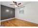 Bedroom with hardwood floors, a ceiling fan, and a window brings in natural light at 3123 Deshong Dr, Stone Mountain, GA 30087