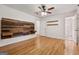 Bright bedroom features hardwood floors, custom wood accents, and lots of natural light at 3123 Deshong Dr, Stone Mountain, GA 30087