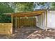 Open carport adjacent to a home's entrance, offering sheltered parking and easy access at 3123 Deshong Dr, Stone Mountain, GA 30087