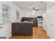 Eat-in kitchen with white cabinets and island featuring modern appliances at 3123 Deshong Dr, Stone Mountain, GA 30087