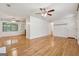 Open-concept living room featuring beautiful hardwood floors and ample natural light at 3123 Deshong Dr, Stone Mountain, GA 30087
