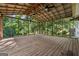 Large screened in porch with an oversized wood floor that provides the perfect setting for relaxation at 3123 Deshong Dr, Stone Mountain, GA 30087