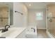 This beautiful bathroom features a garden tub, glass-enclosed shower, and sleek fixtures at 5674 Mountain Cres, Stone Mountain, GA 30087