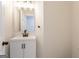 Modern bathroom features a vanity with a black faucet and hardware at 5674 Mountain Cres, Stone Mountain, GA 30087