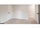 Spacious carpeted bedroom with an ensuite bathroom and large closet at 5674 Mountain Cres, Stone Mountain, GA 30087