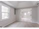 Cozy bedroom with a bright window, soft carpet, and a walk-in closet at 5674 Mountain Cres, Stone Mountain, GA 30087