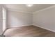 Empty bedroom featuring wood floors and a window at 5674 Mountain Cres, Stone Mountain, GA 30087