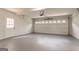 Spacious garage features an automatic door opener and traditional multi-paneled door at 5674 Mountain Cres, Stone Mountain, GA 30087