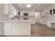 Bright kitchen with white cabinetry, stone countertops, and stainless steel appliances at 5674 Mountain Cres, Stone Mountain, GA 30087