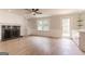 Cozy living room features a fireplace, built-in shelving, and natural light at 5674 Mountain Cres, Stone Mountain, GA 30087