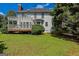 Well-maintained backyard with wood deck, pergola, and lush lawn at 901 Chadwick Park Dr, Lawrenceville, GA 30045