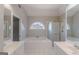Bright bathroom featuring dual sinks, bathtub, and shower with glass door at 901 Chadwick Park Dr, Lawrenceville, GA 30045
