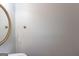 Clean and simple bathroom with a round mirror, modern fixtures, and neutral tones at 901 Chadwick Park Dr, Lawrenceville, GA 30045
