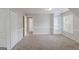 Neutral bedroom with natural light, built in shelving and closet at 901 Chadwick Park Dr, Lawrenceville, GA 30045