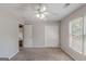 Neutral bedroom with overhead fan and a double door closet at 901 Chadwick Park Dr, Lawrenceville, GA 30045
