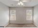 Sunlit bedroom featuring carpet and two windows at 901 Chadwick Park Dr, Lawrenceville, GA 30045