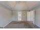 Large carpeted bedroom featuring a tray ceiling at 901 Chadwick Park Dr, Lawrenceville, GA 30045