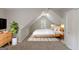 Attic bedroom with sloped ceiling, neutral decor, and plush carpet flooring at 901 Chadwick Park Dr, Lawrenceville, GA 30045
