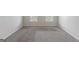 Spacious bedroom featuring carpeted floor and two windows at 901 Chadwick Park Dr, Lawrenceville, GA 30045