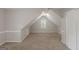 Spacious carpeted bonus room with a window and closet at 901 Chadwick Park Dr, Lawrenceville, GA 30045