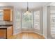 Bright breakfast nook with hardwood floors and large windows at 901 Chadwick Park Dr, Lawrenceville, GA 30045