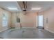 Spacious garage with fluorescent lighting, utility connections, and entry door at 901 Chadwick Park Dr, Lawrenceville, GA 30045