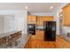 Kitchen featuring wooden cabinets, granite countertops, and modern appliances at 901 Chadwick Park Dr, Lawrenceville, GA 30045