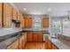 Well-appointed kitchen with granite countertops, wooden cabinetry, and stainless steel appliances at 901 Chadwick Park Dr, Lawrenceville, GA 30045