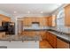 Spacious kitchen with granite countertops, wood cabinets, and a large island at 901 Chadwick Park Dr, Lawrenceville, GA 30045